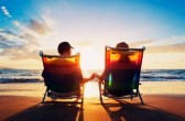 13406333-senior-couple-of-old-man-and-woman-sitting-on-the-beach-watching-sunset
