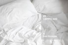 unmade bed sheets